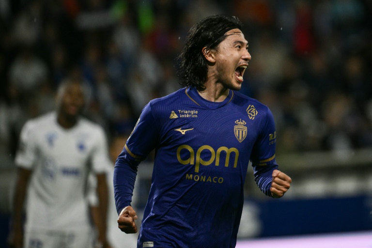 Monaco squeeze past 10-man Auxerre to climb to third