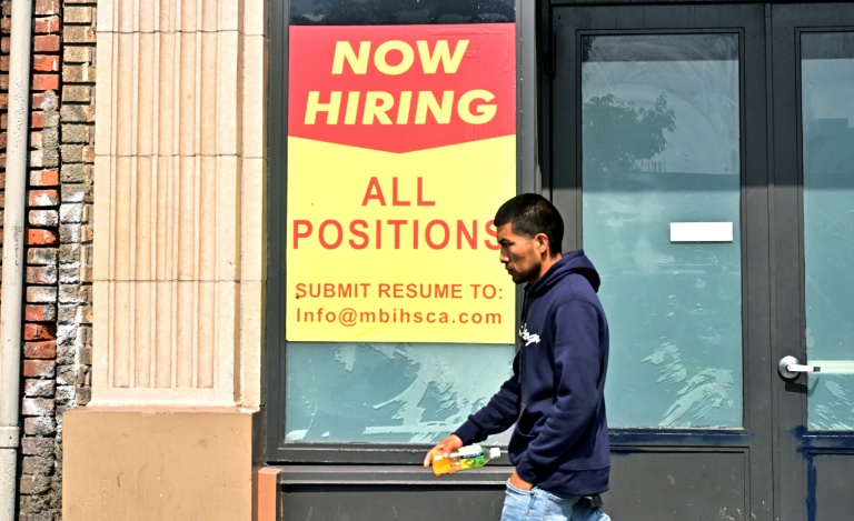 US unemployment up even as hiring beats expectations in delayed report